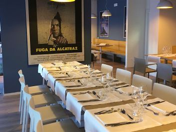 The walls of the restaurant, inside the gates of the Bollate penitentiary, are decorated with prison-movie posters.                                                                (Robert Camuto)