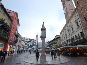 Just days before all of Italy was locked down, Verona's Piazza delle Erbe had few tourists, but locals were still going out to eat and drink, trying to lead somewhat normal lives.                                                                (REUTERS/Newscom/Alberto Lingria)