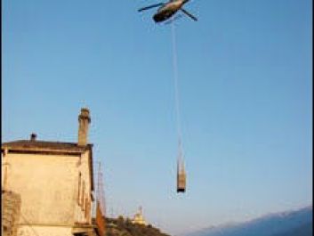 A helicopter carries the harvest from Nino Negri’s Inferno vineyards.