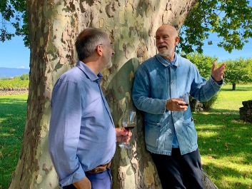 John Malkovich shares a glass with his winemaker, Jean Natoli (left).                                                                (Robert Camuto)