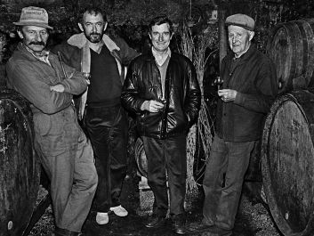 In 1983, Kermit Lynch (second from left) met with artisan Northern Rhône winemakers Raymond Trollat, Gérard Chave and Ernest Trollat.                                                                (Gail Skoff)