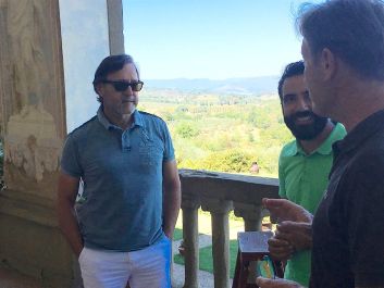 Glynn Cohen (left) on the loggia of Villa Mangiacane with estate manager Graziano Santoro (center) and winemaker Marco Chellini                                                                (Robert Camuto)